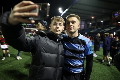 301124 - Cardiff Rugby v Dragons RFC - United Rugby Championship - Cameron Winnett of Cardiff with fans after the game