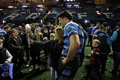 301124 - Cardiff Rugby v Dragons RFC - United Rugby Championship - Teddy Williams of Cardiff with fans after the game