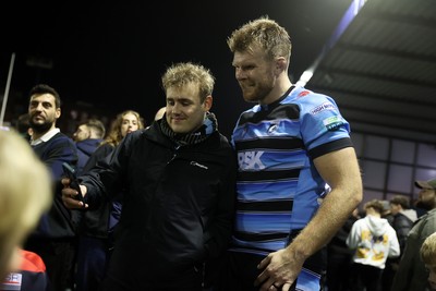 301124 - Cardiff Rugby v Dragons RFC - United Rugby Championship - Josh McNally of Cardiff with fans after the game