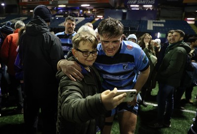 301124 - Cardiff Rugby v Dragons RFC - United Rugby Championship - Alex Mann of Cardiff with fans after the game