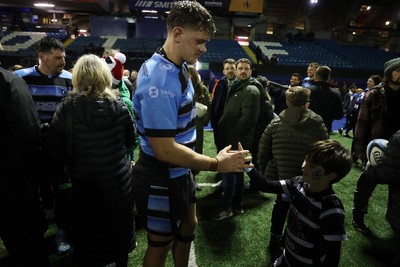 301124 - Cardiff Rugby v Dragons RFC - United Rugby Championship - Alex Mann of Cardiff with fans after the game