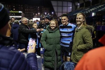 301124 - Cardiff Rugby v Dragons RFC - United Rugby Championship - Ellis Bevan of Cardiff with fans after the game