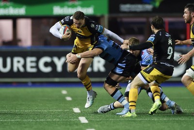 301124 Cardiff Rugby v Dragons RFC, United Rugby Championship - Harry Wilson of Dragons takes on Ed Byrne of Cardiff Rugby and Alun Lawrence of Cardiff Rugby