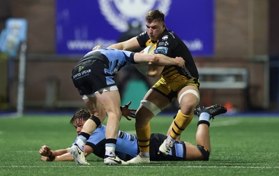 301124 Cardiff Rugby v Dragons RFC, United Rugby Championship - Taine Basham of Dragons holds off Aled Davies of Cardiff Rugby