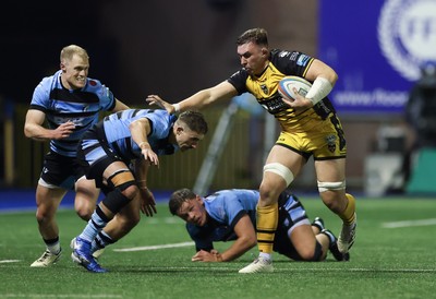 301124 Cardiff Rugby v Dragons RFC, United Rugby Championship - Taine Basham of Dragons holds off Harri Millard of Cardiff Rugby