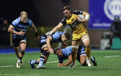 301124 Cardiff Rugby v Dragons RFC, United Rugby Championship - Taine Basham of Dragons holds off Harri Millard of Cardiff Rugby