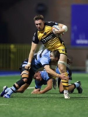 301124 Cardiff Rugby v Dragons RFC, United Rugby Championship - Taine Basham of Dragons holds off Harri Millard of Cardiff Rugby