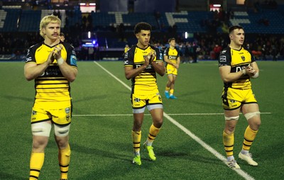 301124 Cardiff Rugby v Dragons RFC, United Rugby Championship - Aaron Wainwright, Rio Dyer and Taine Basham of Dragons applaud the supporters at the end of the match