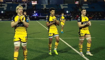 301124 Cardiff Rugby v Dragons RFC, United Rugby Championship - Aaron Wainwright, Rio Dyer and Taine Basham of Dragons applaud the supporters at the end of the match