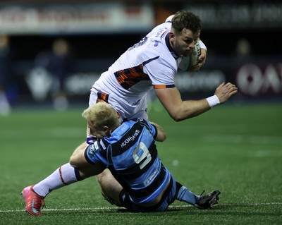 251025 - Cardiff Rugby v Edinburgh - United Rugby Championship - Magnus Bradbury of Edinburgh is tackled by Johan Mulder of Cardiff 