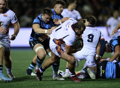 251025 - Cardiff Rugby v Edinburgh - United Rugby Championship - Pierre Schoeman of Edinburgh is tackled by Taine Basham of Cardiff 