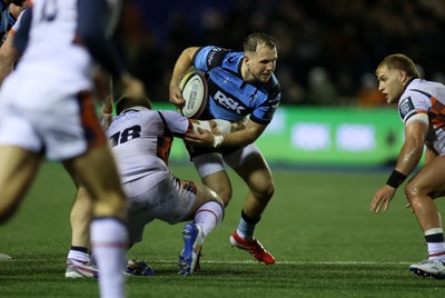 251025 - Cardiff Rugby v Edinburgh - United Rugby Championship - Ioan Lloyd of Cardiff is tackled by Paul Hill of Edinburgh 