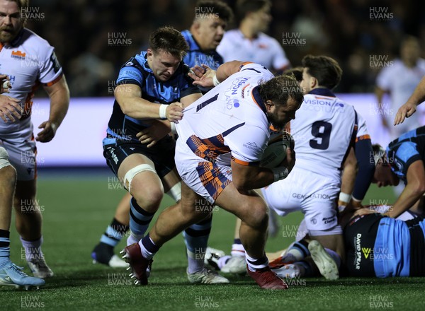 251025 - Cardiff Rugby v Edinburgh - United Rugby Championship - Pierre Schoeman of Edinburgh is tackled by Taine Basham of Cardiff 
