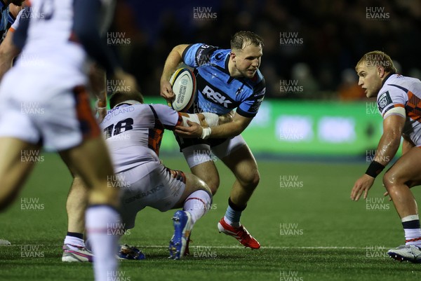 251025 - Cardiff Rugby v Edinburgh - United Rugby Championship - Ioan Lloyd of Cardiff is tackled by Paul Hill of Edinburgh 