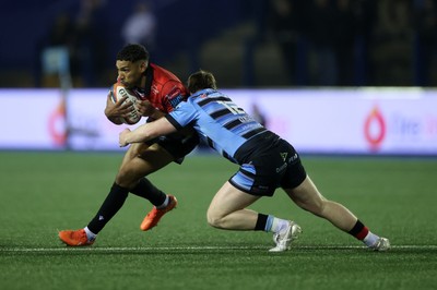 210325 - Cardiff Rugby v Emirates Lions - United Rugby Championship - Gianni Lombard of Lions is tackled by Rory Jennings of Cardiff