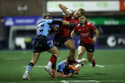 210325 - Cardiff Rugby v Emirates Lions - United Rugby Championship - Richard Kriel of Lions is tackled by Cameron Winnett and Rory Jennings of Cardiff 