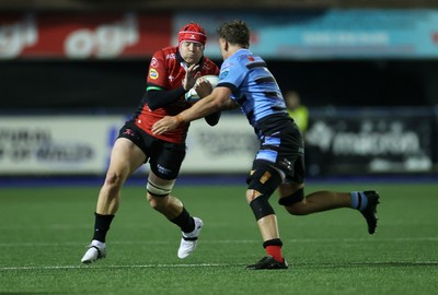 210325 - Cardiff Rugby v Emirates Lions - United Rugby Championship - Francke Horn of Lions is tackled by Alex Mann of Cardiff 