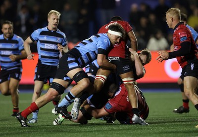 210325 - Cardiff Rugby v Emirates Lions - United Rugby Championship - Teddy Williams of Cardiff tackles Ruben Schoeman of Lions 