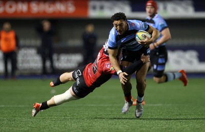 210325 - Cardiff Rugby v Emirates Lions - United Rugby Championship - Gabriel Hamer-Webb of Cardiff is tackled by Henco van Wyk of Lions 