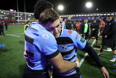 210325 - Cardiff Rugby v Emirates Lions - United Rugby Championship - Gabriel Hamer-Webb and Callum Sheedy of Cardiff at full time