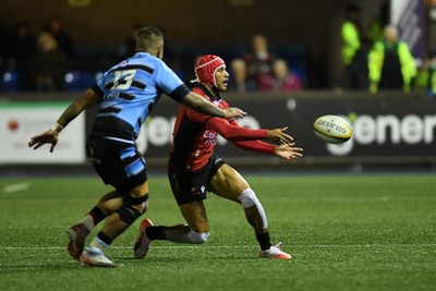 210325 - Cardiff Rugby v Emirates Lions - United Rugby Championship - Edwill Van der Merwe of Emirates Lions is challenged by Rey Lee-Lo of Cardiff