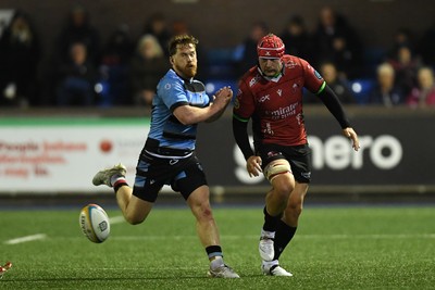 210325 - Cardiff Rugby v Emirates Lions - United Rugby Championship - Rory Jennings of Cardiff is challenged by Francke Horn of Emirates Lions