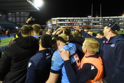 210325 - Cardiff Rugby v Emirates Lions - United Rugby Championship - Cardiff team huddle at full time