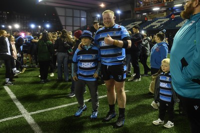 210325 - Cardiff Rugby v Emirates Lions - United Rugby Championship - Kieron Assiratti of Cardiff with fans at full time