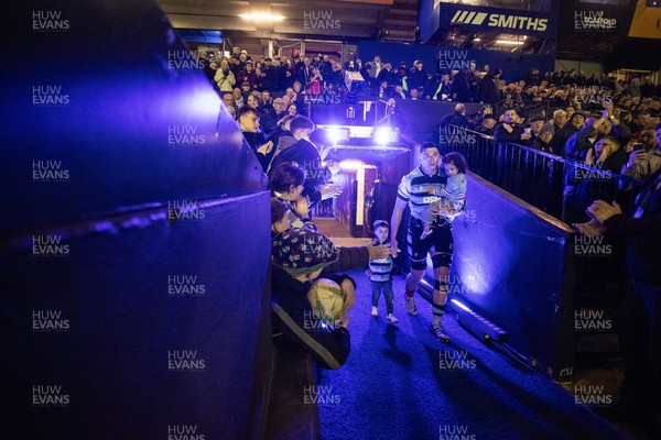 210325 - Cardiff Rugby v Emirates Lions - United Rugby Championship - Seb Davies of Cardiff walks out with his children for his 150th appearance