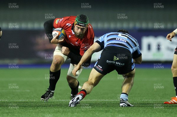 210325 - Cardiff Rugby v Emirates Lions - United Rugby Championship - Ruben Schoeman of Lions is tackled by Liam Belcher of Cardiff 