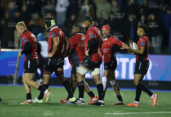 210325 - Cardiff Rugby v Emirates Lions - United Rugby Championship - Asenathi Ntlabakanye of Lions celebrates scoring a try with team mates