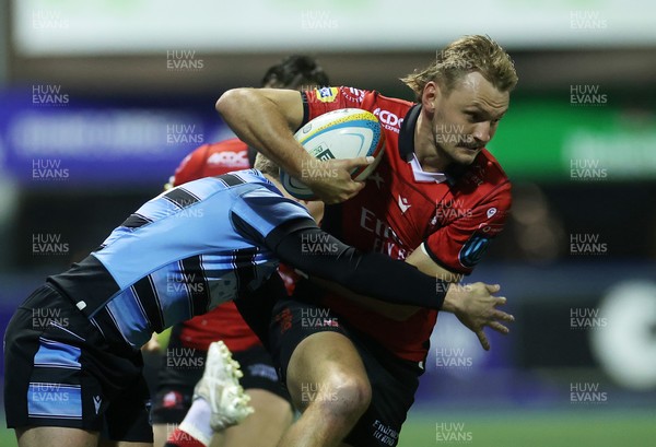 210325 - Cardiff Rugby v Emirates Lions - United Rugby Championship - Richard Kriel of Lions is tackled by Cameron Winnett and Rory Jennings of Cardiff 