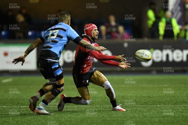 210325 - Cardiff Rugby v Emirates Lions - United Rugby Championship - Edwill Van der Merwe of Emirates Lions is challenged by Rey Lee-Lo of Cardiff