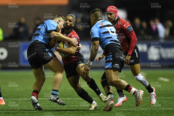 210325 - Cardiff Rugby v Emirates Lions - United Rugby Championship - Darrien Landsberg of Emirates Lions is challenged by Danny Southworth of Cardiff