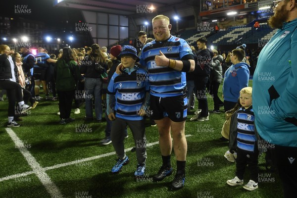 210325 - Cardiff Rugby v Emirates Lions - United Rugby Championship - Kieron Assiratti of Cardiff with fans at full time