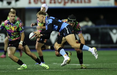 270925 - Cardiff Rugby v Emirates Lions - United Rugby Championship - Cameron Winnett of Cardiff is tackled by Dylan Sjoblom of Lions 