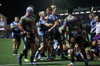 270925 - Cardiff Rugby v Emirates Lions - United Rugby Championship - Alex Mann of Cardiff celebrates scoring a try with team mates