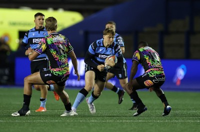 270925 - Cardiff Rugby v Emirates Lions - United Rugby Championship - Jacob Beetham of Cardiff is tackled by Rynhardt Jonker of Lions 