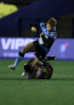270925 - Cardiff Rugby v Emirates Lions - United Rugby Championship - Jacob Beetham of Cardiff is tackled by Lubabalo Dobela of Lions 