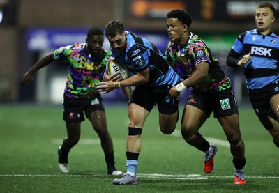 270925 - Cardiff Rugby v Emirates Lions - United Rugby Championship - Harri Millard of Cardiff is tackled by Angelo Davids of Lions 