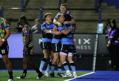270925 - Cardiff Rugby v Emirates Lions - United Rugby Championship - Evan Lloyd of Cardiff celebrates scoring a try with team mates