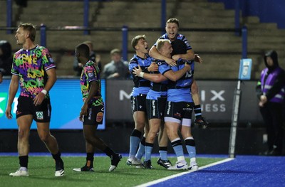 270925 - Cardiff Rugby v Emirates Lions - United Rugby Championship - Evan Lloyd of Cardiff celebrates scoring a try with team mates