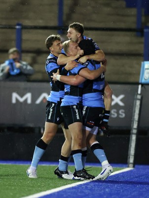 270925 - Cardiff Rugby v Emirates Lions - United Rugby Championship - Evan Lloyd of Cardiff celebrates scoring a try with team mates