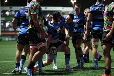 270925 - Cardiff Rugby v Emirates Lions - United Rugby Championship - Evan Lloyd of Cardiff celebrates scoring a try with team mates
