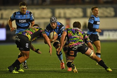 270925 - Cardiff Rugby v Emirates Lions - United Rugby Championship - Alun Lawrence of Cardiff Rugby is challenged by Ruan Delport of Lions