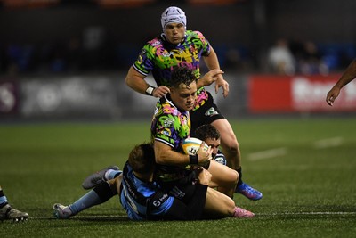 270925 - Cardiff Rugby v Emirates Lions - United Rugby Championship - Quan Horn of Lions is challenged by Jacob Beetham of Cardiff Rugby