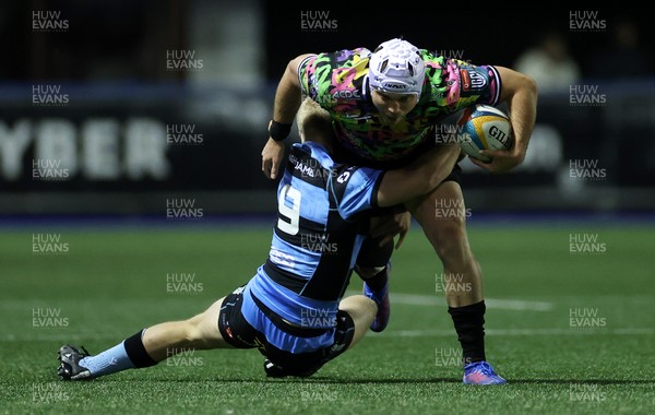 270925 - Cardiff Rugby v Emirates Lions - United Rugby Championship - Henco van Wyk of Lions is tackled by Johan Mulder of Cardiff 