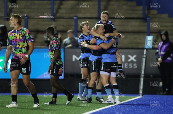 270925 - Cardiff Rugby v Emirates Lions - United Rugby Championship - Evan Lloyd of Cardiff celebrates scoring a try with team mates