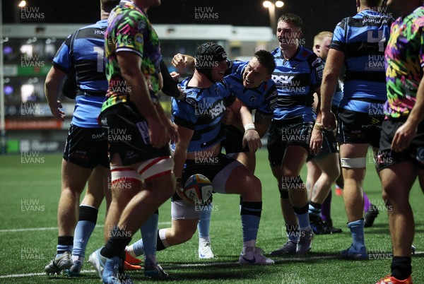270925 - Cardiff Rugby v Emirates Lions - United Rugby Championship - Evan Lloyd of Cardiff celebrates scoring a try with team mates