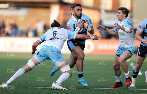 260322 - Cardiff Rugby v Glasgow Warriors - United Rugby Championship - Willis Halaholo of Cardiff Rugby is tackled by Kyle Steyn of Glasgow